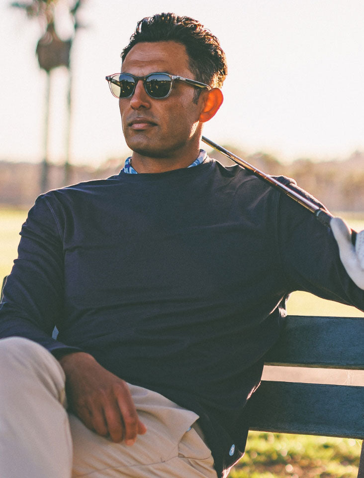 Stylish sunglasses featured on a golf-themed carousel image, perfect for sunny adventures on the green.